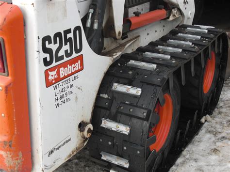 ice cleats for skid steer tracks|skid steer snow tracks.